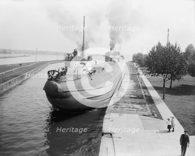Whaleback entering Weitzel Lock, Sault Sainte Marie, Mich., between 1900 and 1910. Creator: Unknown.