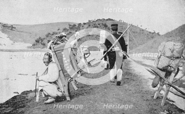 Korean coolies acting as porters for Japanese soldiers, Russo-Japanese War, 1904-5. Artist: Unknown