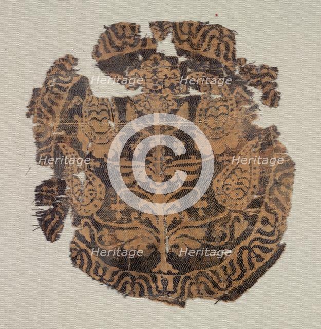 Roundel with curvilinear palmette tree, from a tunic, 600-850. Creator: Unknown.