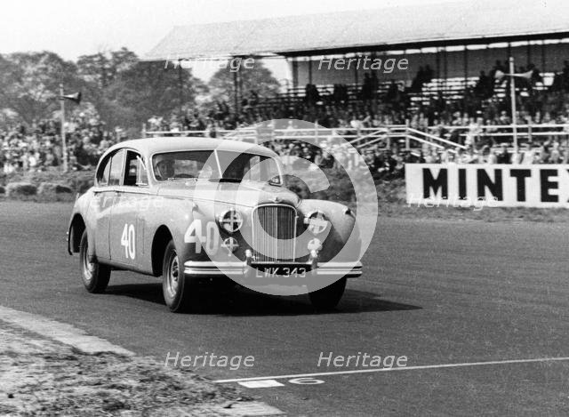 1953 Jaguar MkVII, Stirling Moss at Silverstone. Creator: Unknown.