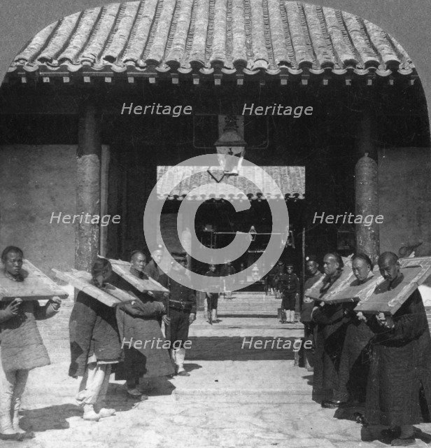 'Chinese criminals in the Viceroy's Yamen, now used as a jail', Tientsin (Tianjin), China, 1901. Artist: The Fine Art Photographers Co