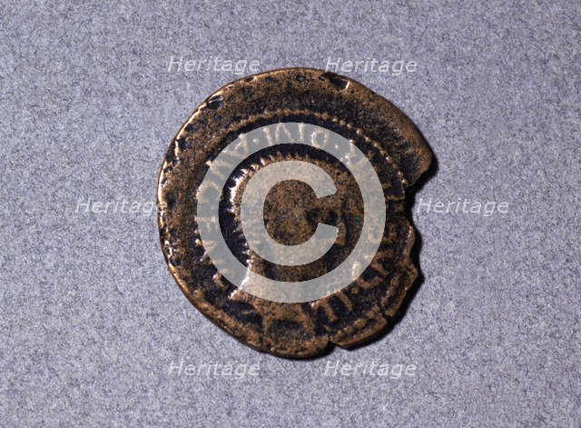 Roman coin from the first half of the first century AC, with a head facing right and the legend '…