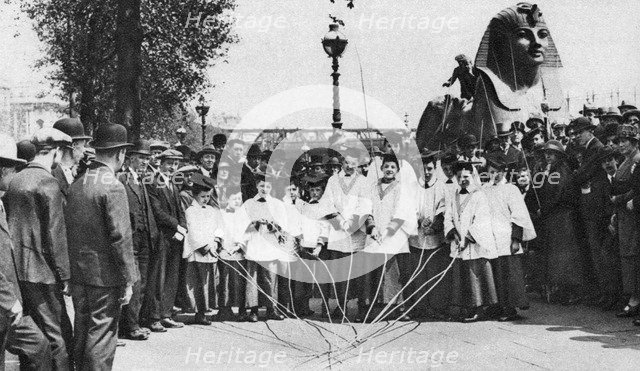 Choirboys of St Clement Danes beating the boundary-marks with long wands, London, 1926-1927. Artist: Unknown