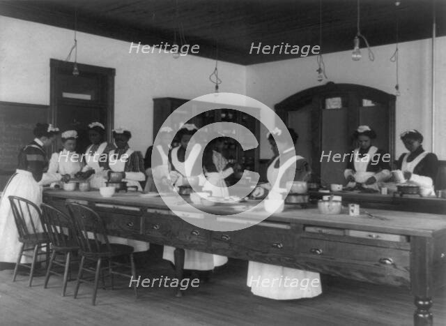 Ten Afro-American women in cooking class at Hampton Institute, Hampton, Va., between 1899 and 1900. Creator: Frances Benjamin Johnston.