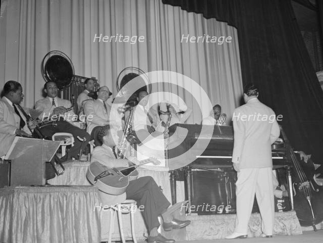 Portrait of Duke Ellington, Junior Raglin, Juan Tizol...Howard Theater(?), Washington, D.C., 1938. Creator: William Paul Gottlieb.