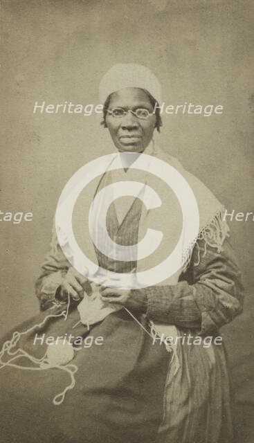 Portrait of abolitionist Sojourner Truth, sitting with yarn and knitting needles, 1864. Creator: JH Preiter.