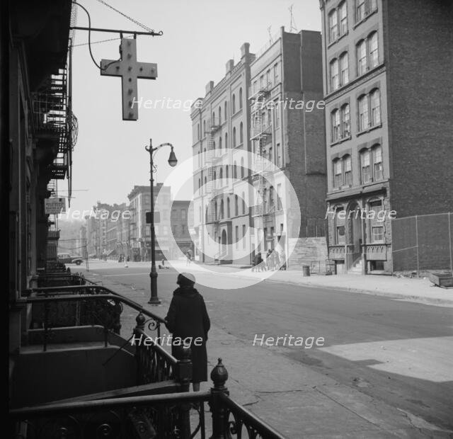A Harlem street scene, New York, 1943. Creator: Gordon Parks.