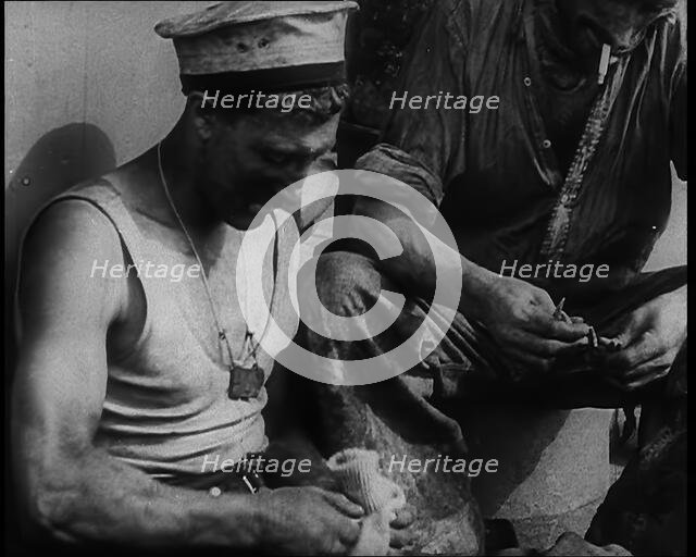 British Soldier Counting Bullets on Board a Ship Evacuating Him from Dunkirk, 1940. Creator: British Pathe Ltd.