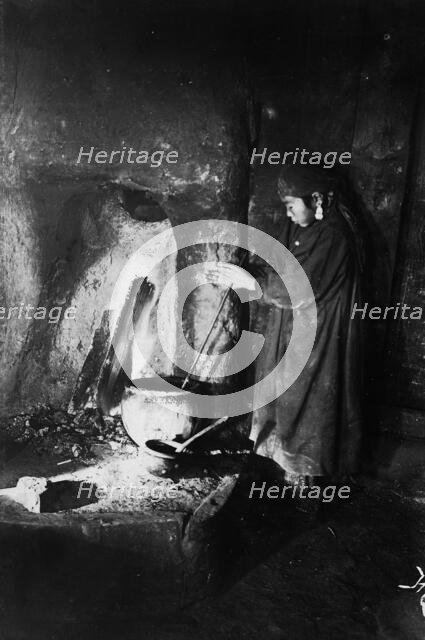Girl at the hearth, late 19th cent - early 20th cent. Creator: I Popov.