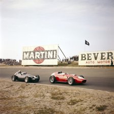 Two racing cars taking a bend, Dutch Grand Prix, Zandvoort, Holland, 1959. Artist: Unknown