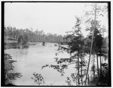 Quinnesee [sic] Falls, Mich., the river above the falls, between 1880 and 1899. Creator: Unknown.