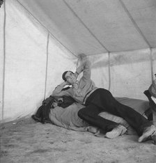 Sick migratory worker from Colorado in FSA camp, Calipatria, Imperial Valley, 1939. Creator: Dorothea Lange.