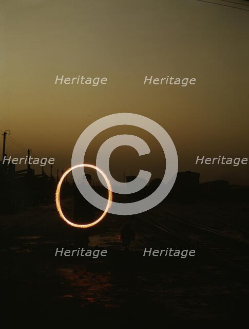 Indiana Harbor Belt RR, switchman demonstrating signal with a "fusee"..., 1943. Creator: Jack Delano.