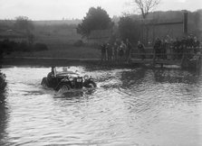 MG PA driving through a ford during a motoring trial, 1936. Artist: Bill Brunell.