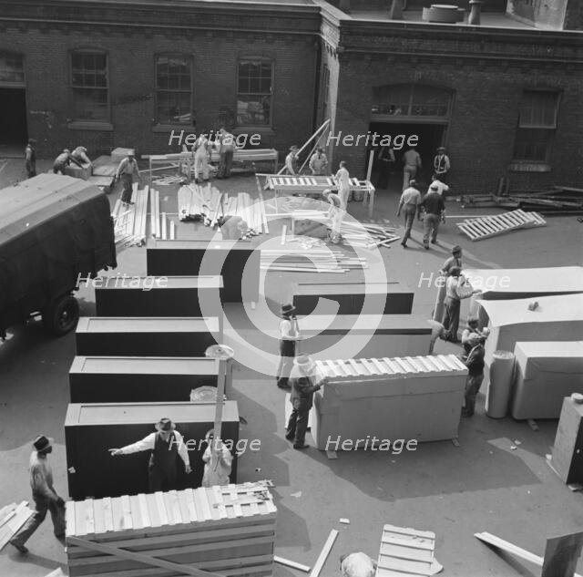United States government workers and carpenters making crates for steel... Washington, D.C., 1942. Creator: Gordon Parks.