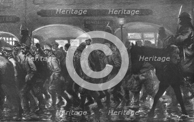 ''Arrivee a remiremont des prisonniers de l'Hartmannswillerkopf, le soir du 24 decembre 1915. Creator: Georges Bertin Scott.