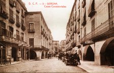 Public vehicles parked on Vi Square, in front of the town hall in Girona, in a postcard from the …
