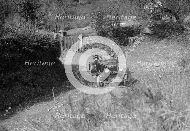 Kitty Brunell driving a 1930 2-seater Ford Model A, 1931.   Artist: Bill Brunell.