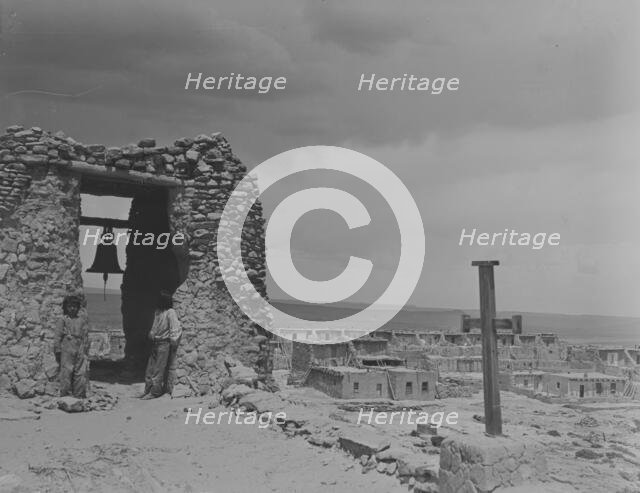 North American Indian children on roof of San Estevan Mission, Acoma Pueblo, New Mexico, c1899-c1928 Creator: Arnold Genthe.