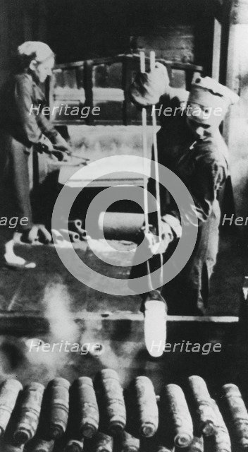 Women manufacturing shell casings in a Russian factory, World War II, 1943. Artist: Unknown