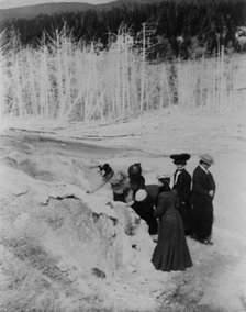 A group of tourists explore land formations in Yellowstone National Park, 1903. Creator: Frances Benjamin Johnston.