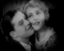 The Actor Ray Milland Embracing a Female British Actor, 1920s. Creator: British Pathe Ltd.