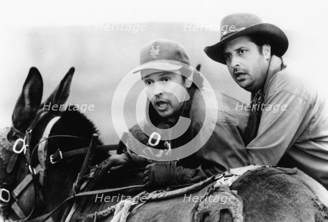 Billy Crystal (1947- ) and John Lovitz, American actors, 1993. Artist: Unknown