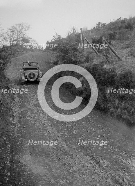 Kitty Brunell driving a 1930 2-seater Ford Model A, 1931.   Artist: Bill Brunell.