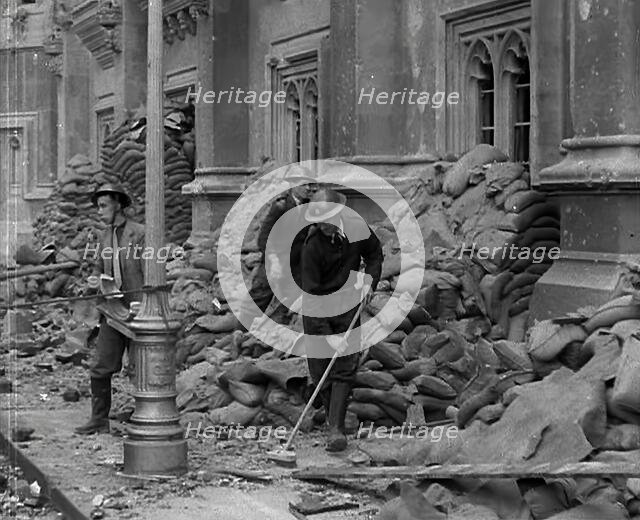 British Air Raid Wardens Clearing up Rubble Around the Palace of Westminster, 1941. Creator: British Pathe Ltd.