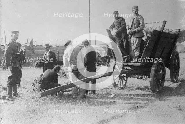 Wynsdorf (Zossen), French prisoners receiving cabbages, 7 Jan 1915. Creator: Bain News Service.