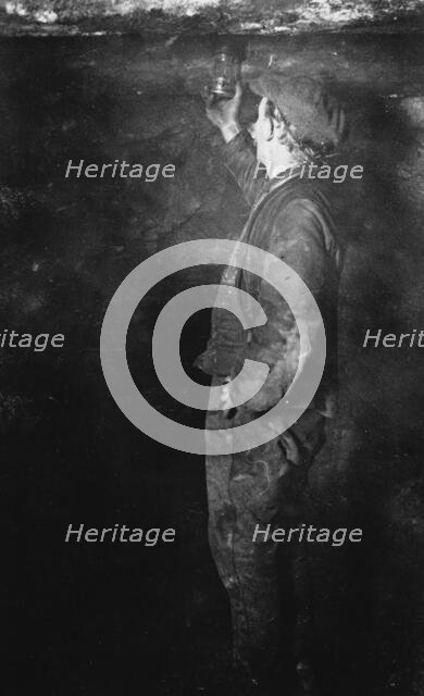 Coal Mining, Fireman searching for Gas postcard, c1900s. Creator: Unknown.