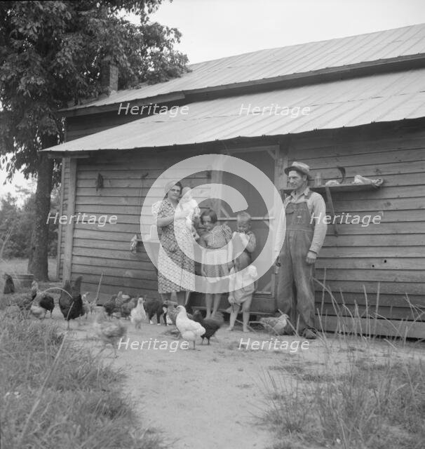 Possibly: Tobacco sharecropper with his oldest daughter, Person County, North Carolina, 1939. Creator: Dorothea Lange.