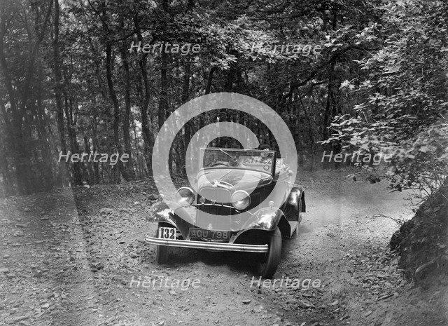Ford V8 competing in the B&HMC Brighton-Beer Trial, Fingle Bridge Hill, Devon, 1934. Artist: Bill Brunell.