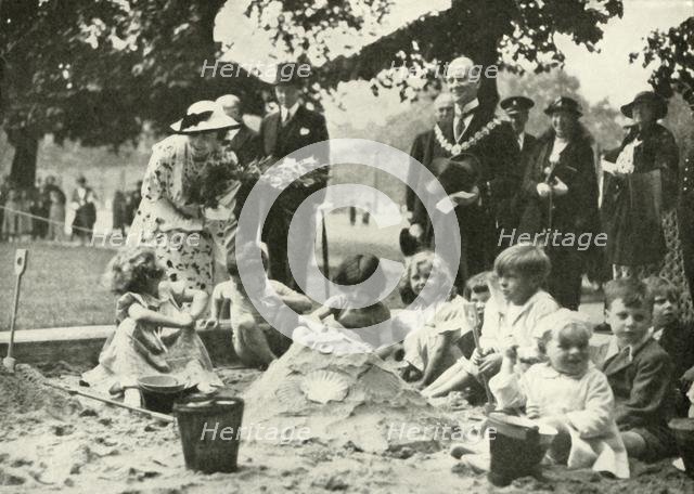 'Her Majesty ..., at the New Playground on the Site of the Old Foundling Hospital', 1936, 1937. Creator: Unknown.