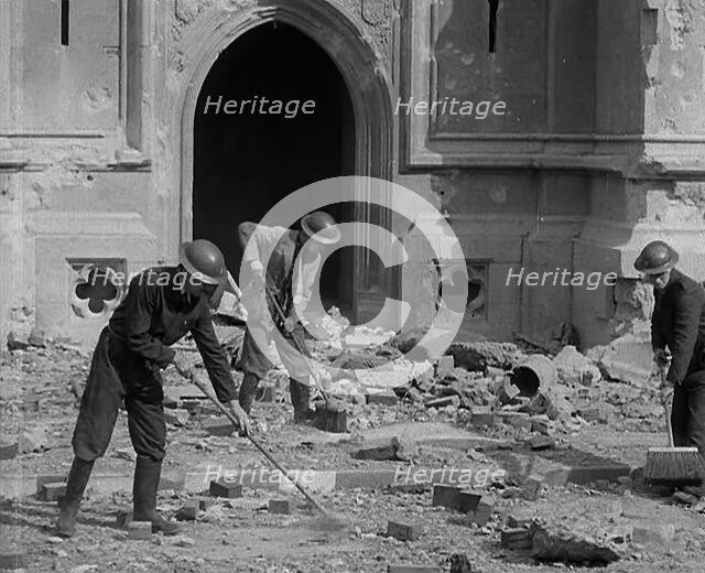 British Air Raid Wardens Clearing up Rubble Around the Palace of Westminster, 1941. Creator: British Pathe Ltd.
