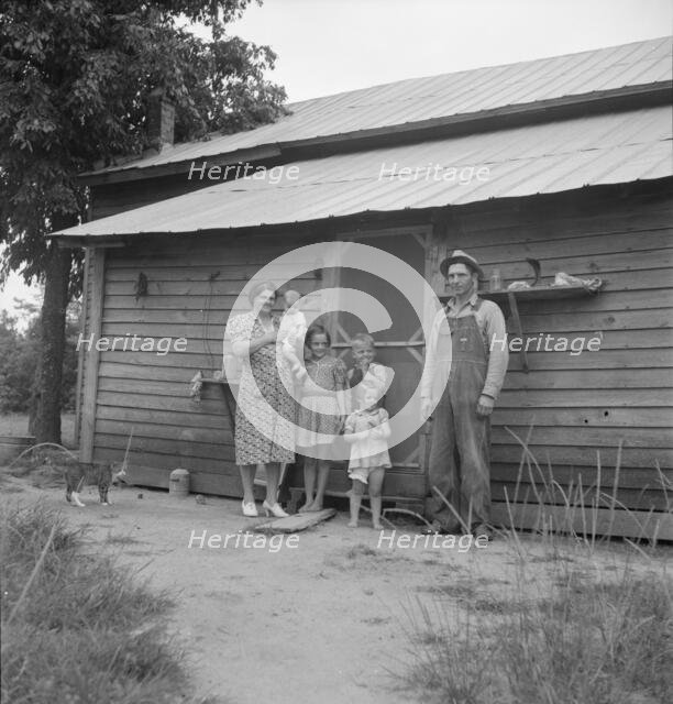 Possibly: Tobacco sharecropper with his oldest daughter, Person County, North Carolina, 1939. Creator: Dorothea Lange.