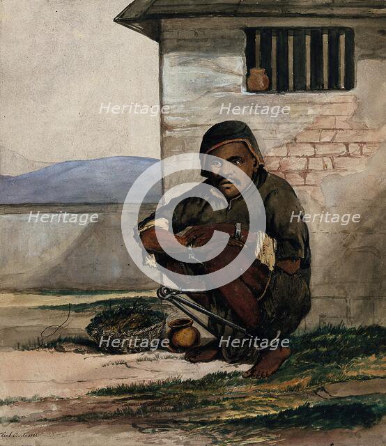 A man of Simla, squatting in a prison with manacles around his ankles, 1866. Creator: R Clint.