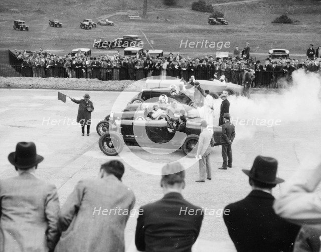 Cars lined up for the start of a race, Brooklands, Surrey, c 1925-c1930. Artist: Unknown