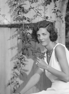 Kramer, A.L., Mrs. (Alice Bishop), seated outdoors, 1932 Creator: Arnold Genthe.