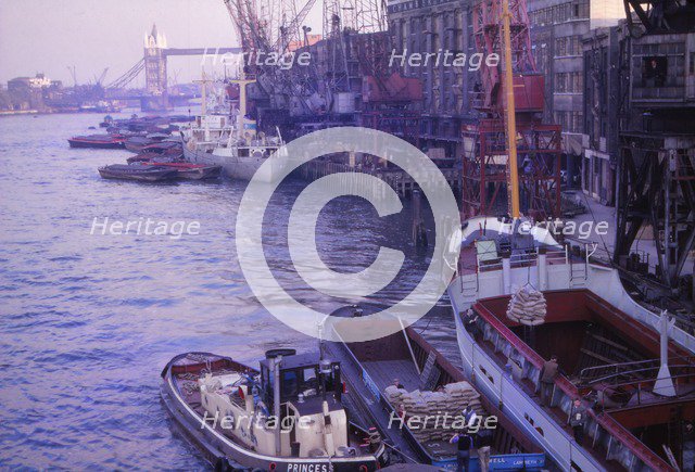 Barges in the Pool of London. River Thames and Tower Bridge, London, 1962. Artist: CM Dixon.