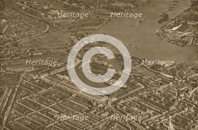'The Three Basins of the East India Docks and the Blackwall Reach of the Thames Seen From The Air',  Creator: Aerofilms.