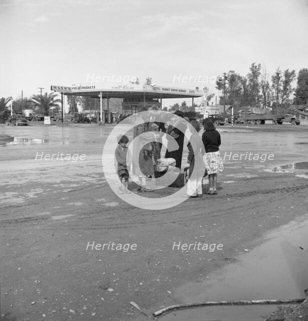 Family of homeless, walking people are left at the edge of the next town, 1939. Creator: Dorothea Lange.