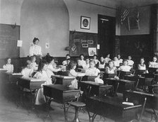 Young girls seated at desks in Washington, D.C. classroom, (1899?). Creator: Frances Benjamin Johnston.