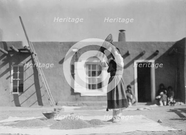 Winnowing wheat, c1905. Creator: Edward Sheriff Curtis.