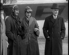 Four Male Civilians Standing in Front of a Plane, 1929. Creator: British Pathe Ltd.