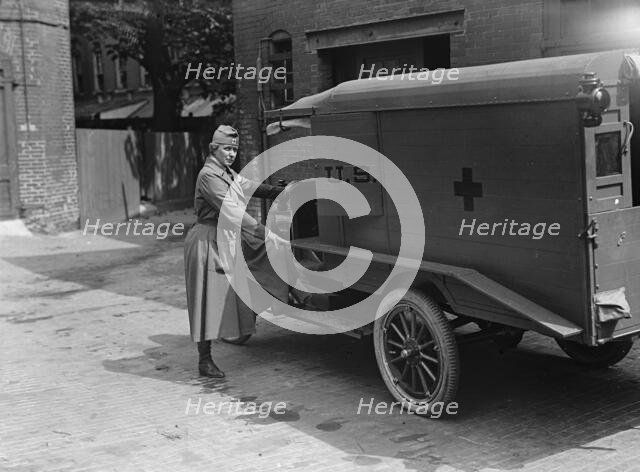 Harriman, Mrs. James Borden with Red Cross Ambulance, 1917. Creator: Harris & Ewing.
