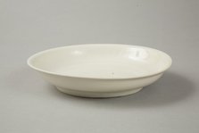 White dish with anhua design of two phoenix and cloud scroll design, Song dynasty, c.1300. Artist: Unknown.