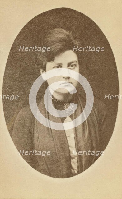 Head-and-shoulders portrait of woman, facing slightly right, between 1880 and 1886. Creator: Unknown.