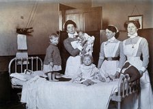 St Bartholomew's Hospital, London: nurses and children in casualty, c1890. Creator: Unknown.