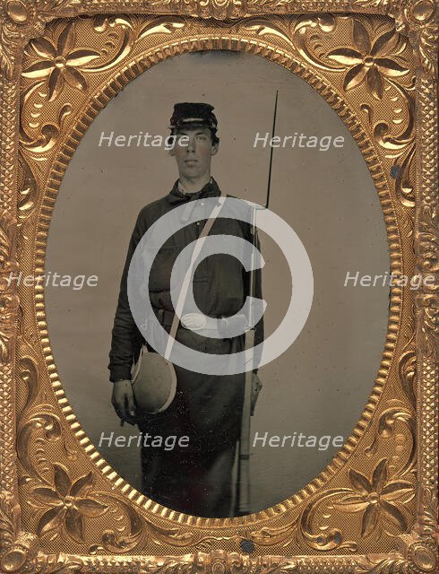Civil War Union Soldier with Rifle and Canteen, in Studio, 1861-65. Creator: Unknown.